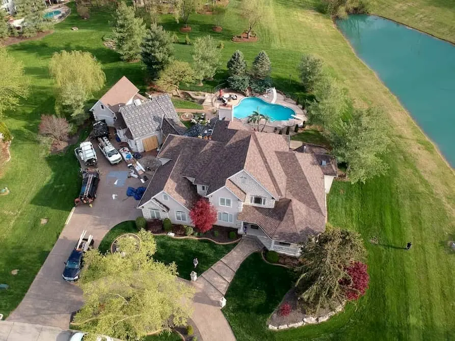 Aerial view of a large residential roof replacement in Lake St. Louis, Missouri